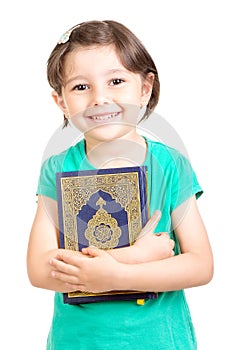 Happy young girl holding Quraan