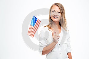 Happy young girl holding USA flag