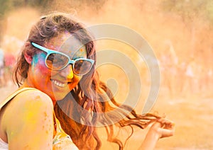 Happy young girl on holi color festival