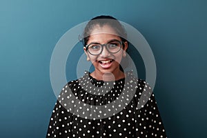 Happy young girl of Indian origin with a smiling face