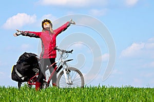 Happy young girl on mountain bike photo