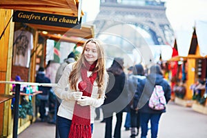 Happy young girl on a Parisian Christmas market