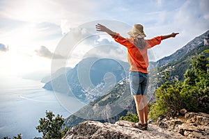 Happy young girl on Positano coast background, Amalfi, Italy