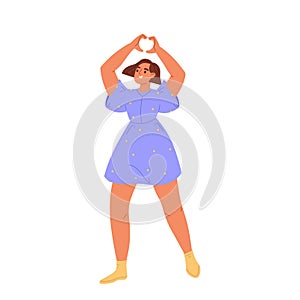 Happy young girl showing heart shape finger hand gesture. Cheerful woman demonstrate love happiness