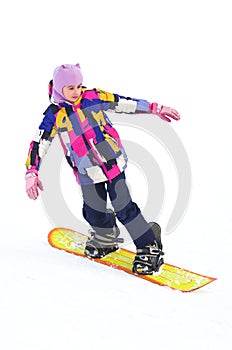 Happy young girl snowboarding on a snow slope, vertical