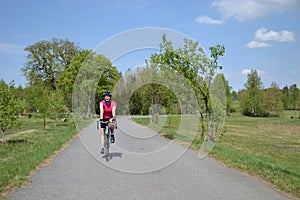 Happy young girl on spring bike ride