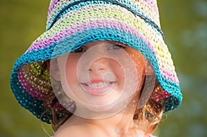 Happy young girl with sun hat