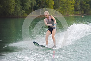 Happy young girl on water ski