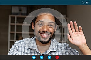 Happy young handsome african ethnicity man waving hand.