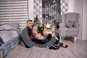 Happy young hetero couple at home. Home interior