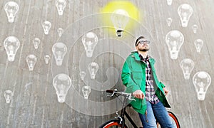 Happy young hipster man with fixed gear bike