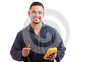 Happy young Hispanic electrician