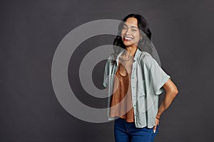 Happy young hispanic woman looking at camera with big smile