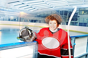 Happy young hockey player preparing to hit the ice