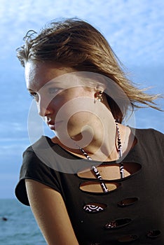 Happy young lady face on a beach