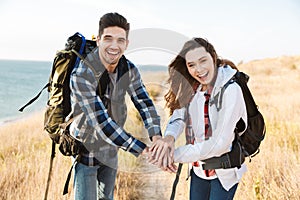 Happy young loving couple outside in free alternative vacation camping