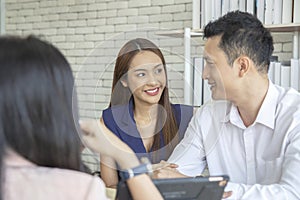 Happy young loving couple talking to their real estate agent with smile looking at house , Planning for the future of the family