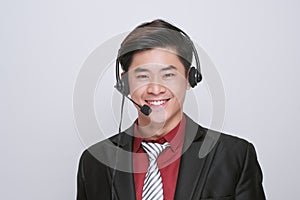 Happy young male customer support executive working isolated on white background