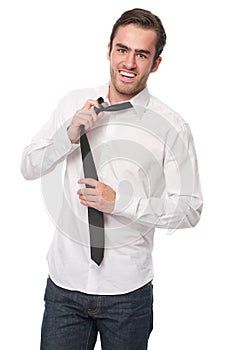 Happy young man adjusting necktie