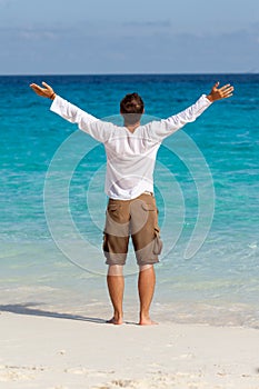Happy young man on the beach