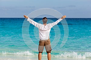 Happy young man on the beach