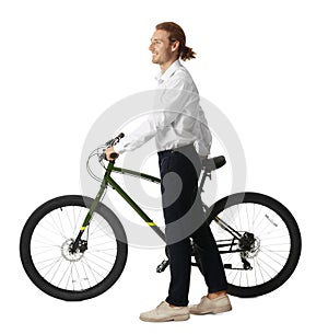 Happy young man with bicycle on background