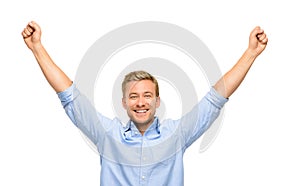 Happy young man celebrating success on white background