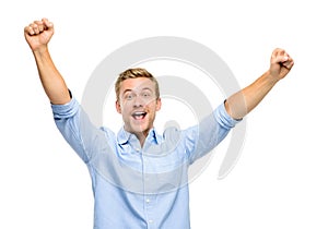 Happy young man celebrating success on white background