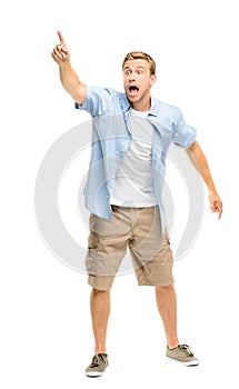 Happy young man celebrating success on white background