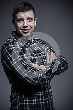 Happy young man in checked shirt