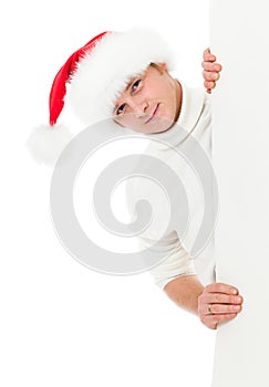 Happy young man in Christmas Santa's hat photo