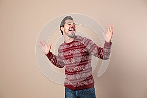Happy young man in Christmas sweater