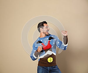 Happy young man in Christmas sweater