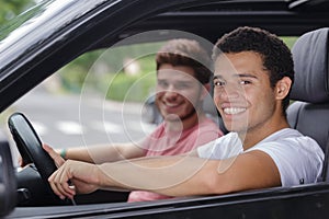 happy young man driving car