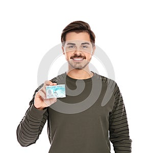 Happy young man with driving license