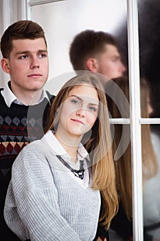 Happy young man embracing his girlfriend