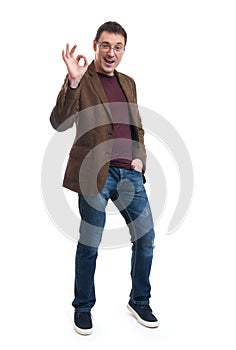 Happy young man gesturing OK sign