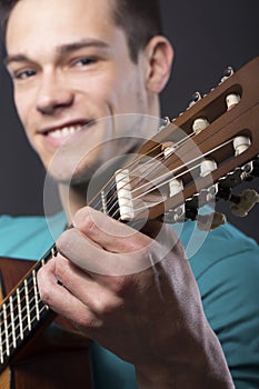 Happy Young Man With Guitar
