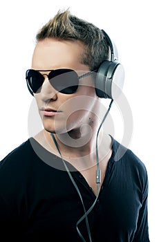 Happy young man listening to music with headphones