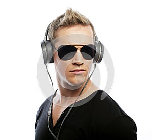 Happy young man listening to music with headphones