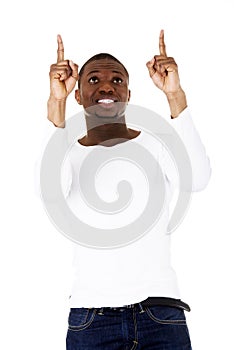 Happy young man pointing at something