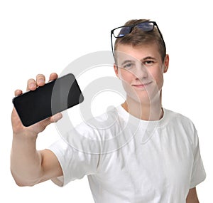 Happy young man show display of mobile cell phone with blank scr