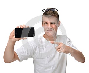 Happy young man show display of mobile cell phone with blank screen