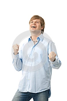 Happy young man showing winning gesture