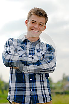 Happy young man smiling outdoors