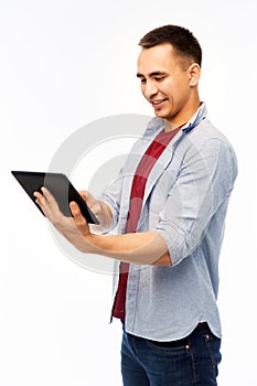 Happy young man with tablet computer