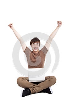 Happy young man using laptop