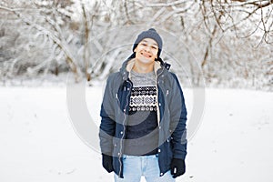 Happy young man in winter clothes and stylish fashionable