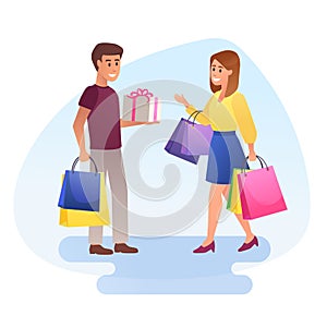 Happy young man and woman with shopping bags