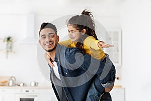 Happy Young Middle-Eastern Father And Little Daughter Having Fun Together At Home